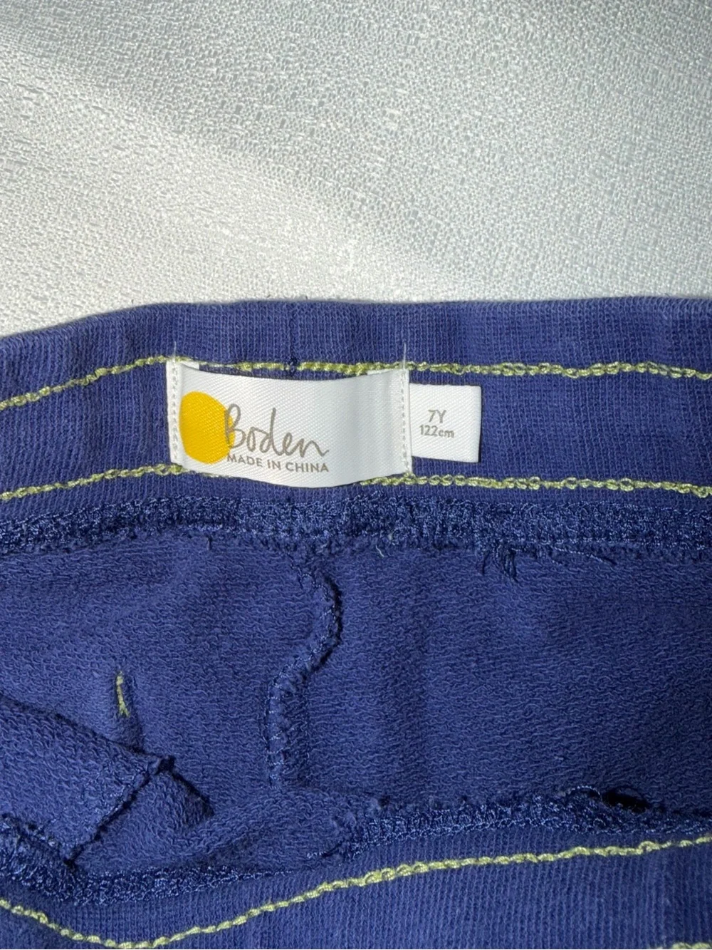 Two Mini Boden appliqué T-shirts, and two pair of shorts size 5/6
